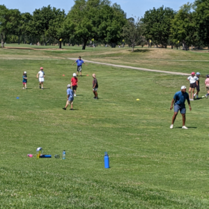 Junior golfers playing at summer camp